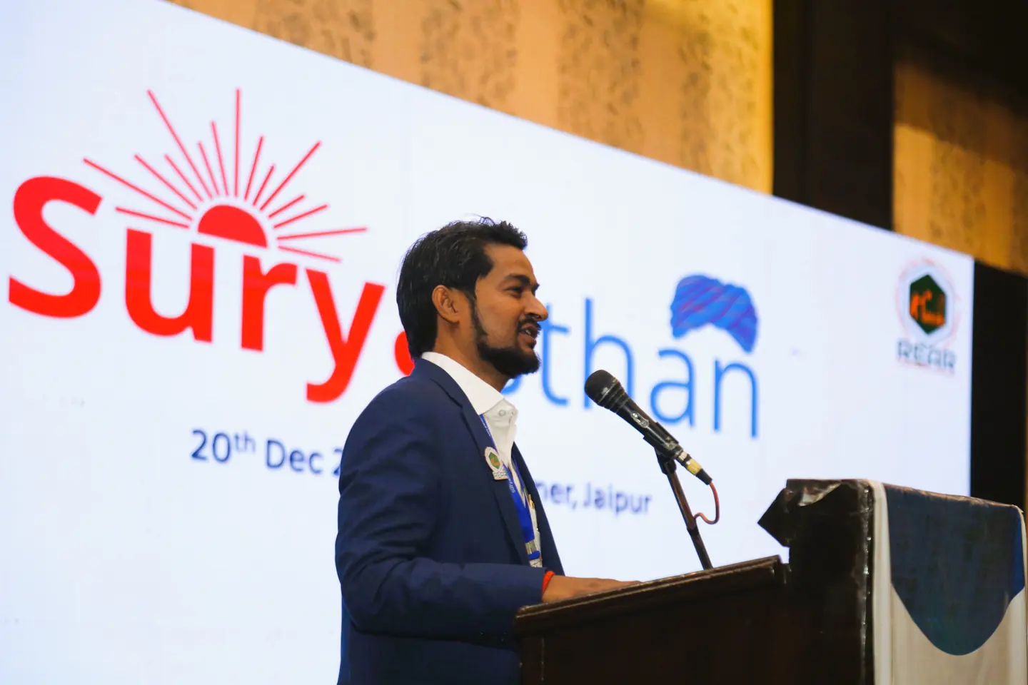 A speaker delivering the 2025 Suryasthan knowledge session