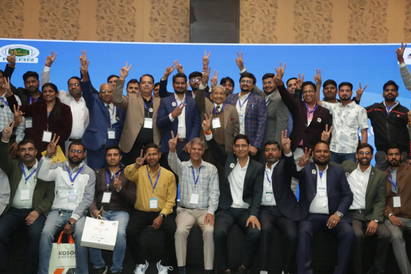 Solar professionals gathered for a Suryasthan 2025 stage photograph